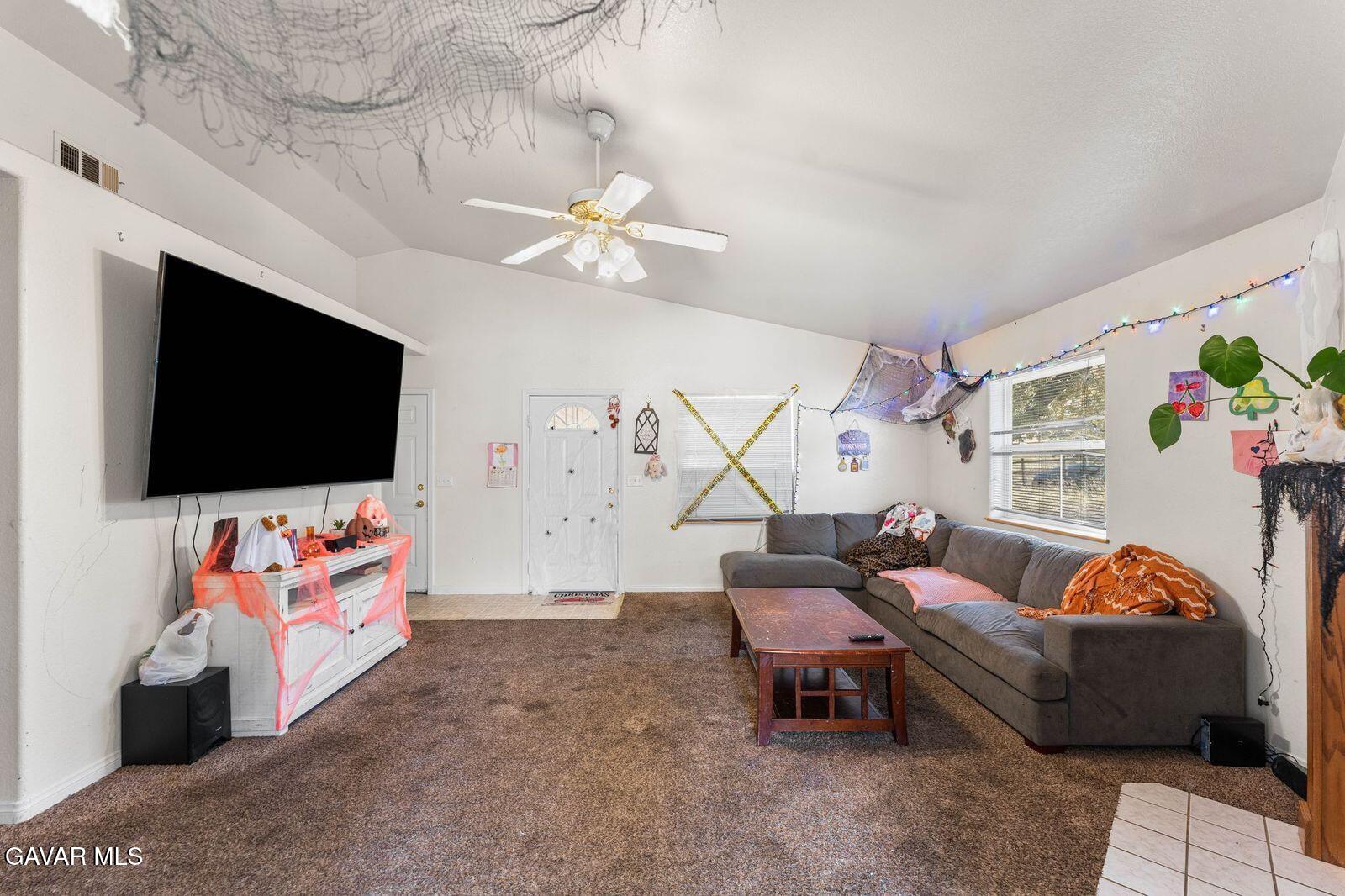 18330 Basil Drive Tehachapi, CA 93561 - Photo 11 of 47 a living room with furniture and a flat screen tv
