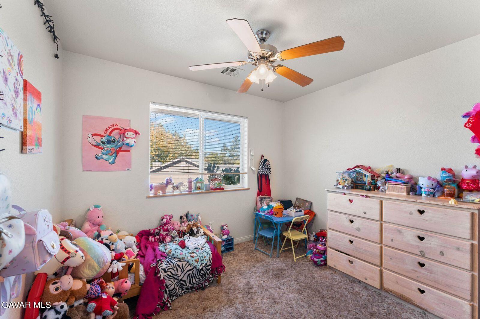 18330 Basil Drive Tehachapi, CA 93561 - Photo 27 of 47 a bed room with a bed and a dresser