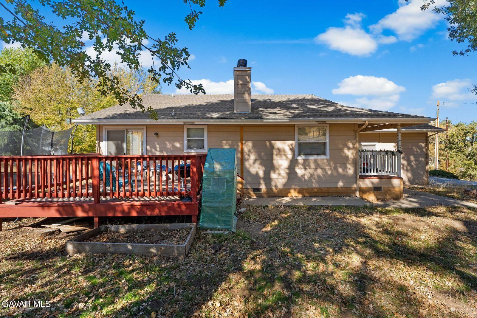 18330 Basil Drive Tehachapi, CA 93561 - Photo 30 of 47 a view of a house with a wooden deck