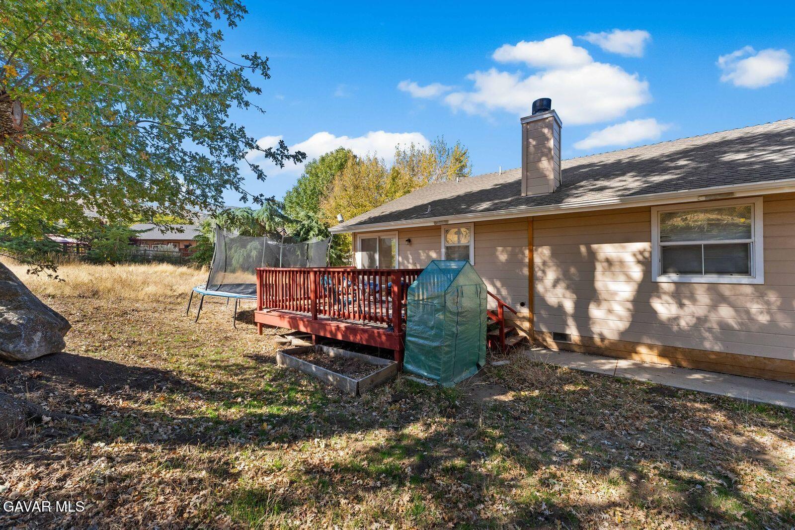 18330 Basil Drive Tehachapi, CA 93561 - Photo 31 of 47 a view of a house with a yard