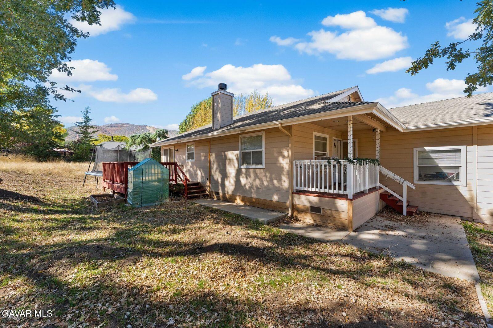 18330 Basil Drive Tehachapi, CA 93561 - Photo 32 of 47 a view of a house with a yard