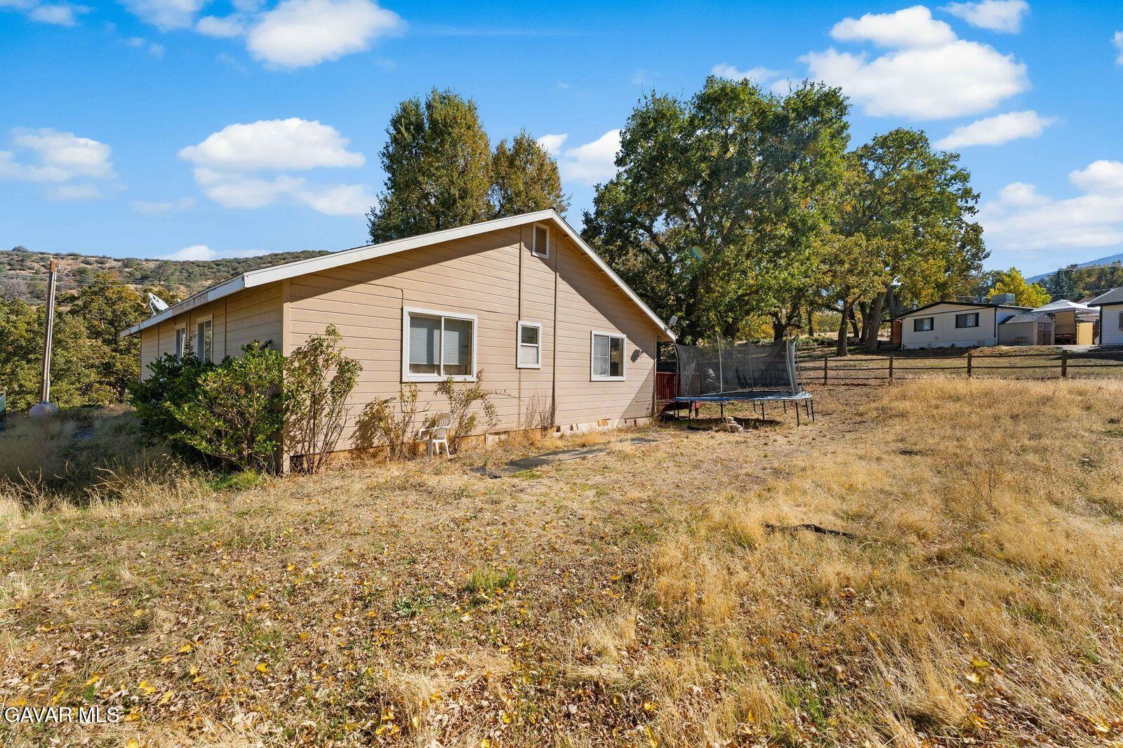 18330 Basil Drive Tehachapi, CA 93561 - Photo 34 of 47 a view of a house with a yard
