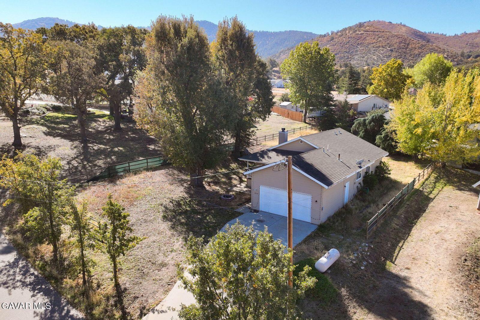 18330 Basil Drive Tehachapi, CA 93561 - Photo 41 of 47 a view of a house with a yard