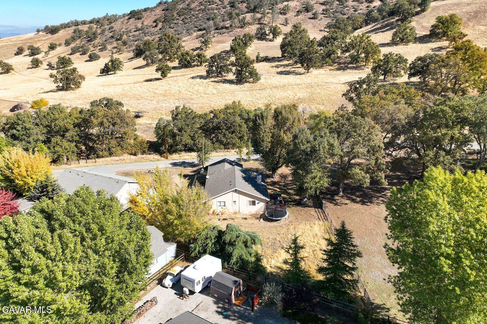 18330 Basil Drive Tehachapi, CA 93561 - Photo 44 of 47 a view of a yard with snow on the road