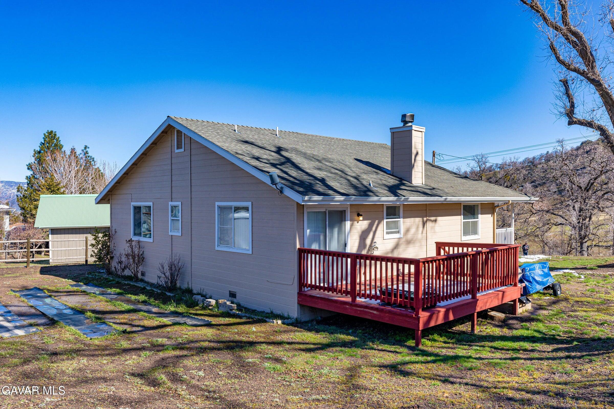 18330 Basil Drive Tehachapi, CA 93561 - Photo 5 of 47 a view of a house with a yard balcony and outdoor seating