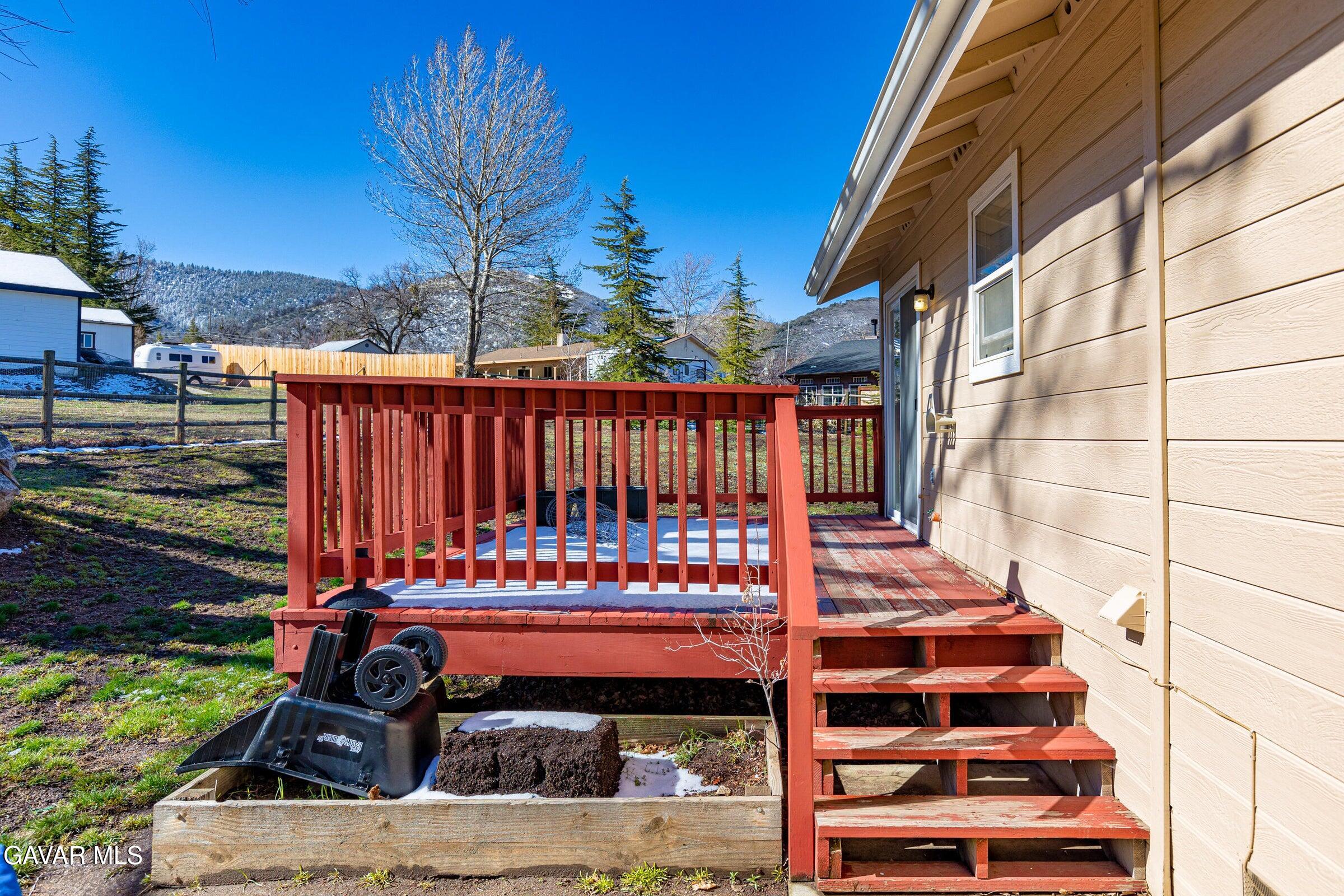 18330 Basil Drive Tehachapi, CA 93561 - Photo 6 of 47 a view of a brick building with a yard