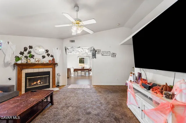 a living room with furniture and a fireplace