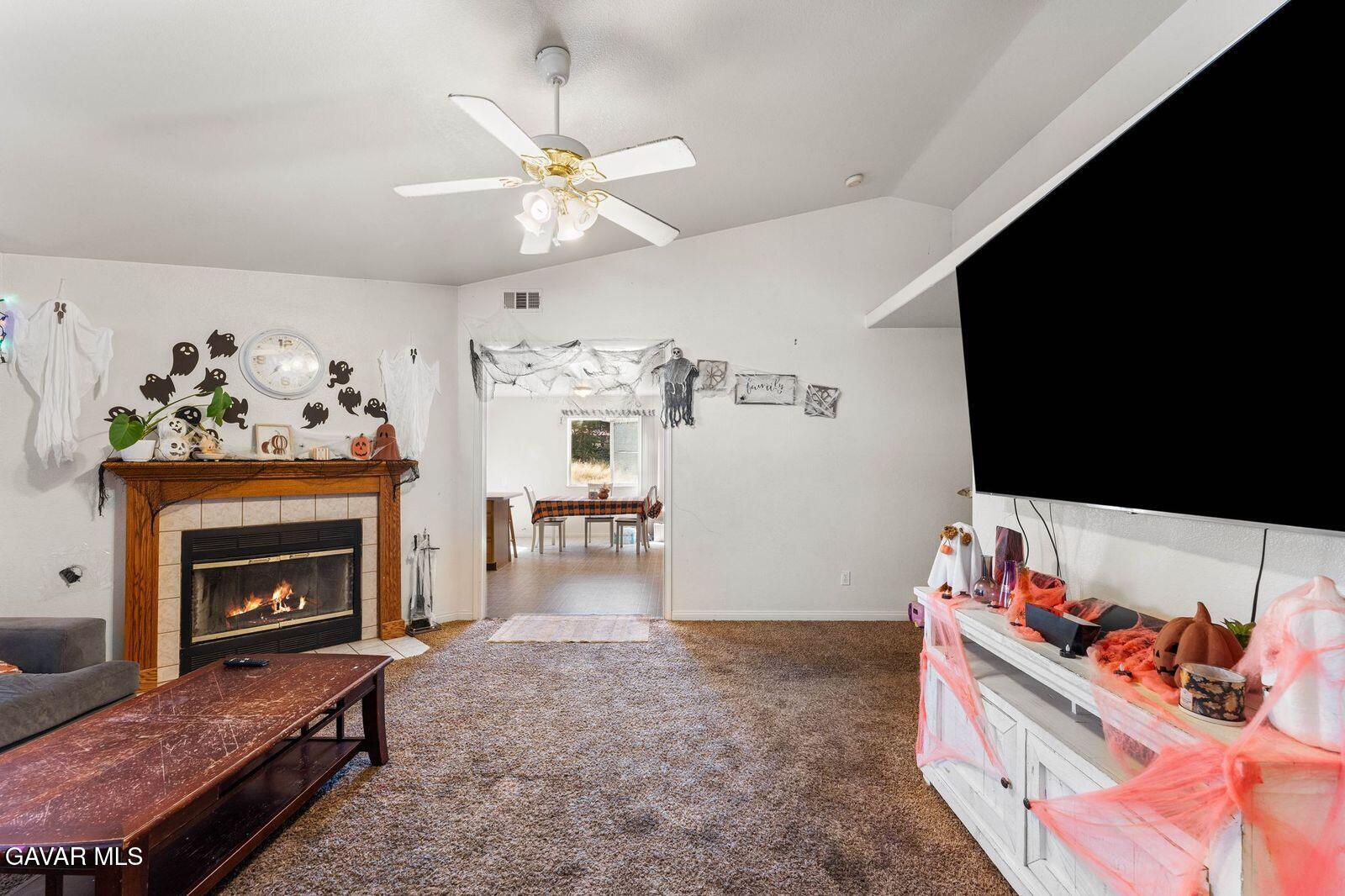 18330 Basil Drive Tehachapi, CA 93561 - Photo 7 of 47 a living room with furniture and a fireplace