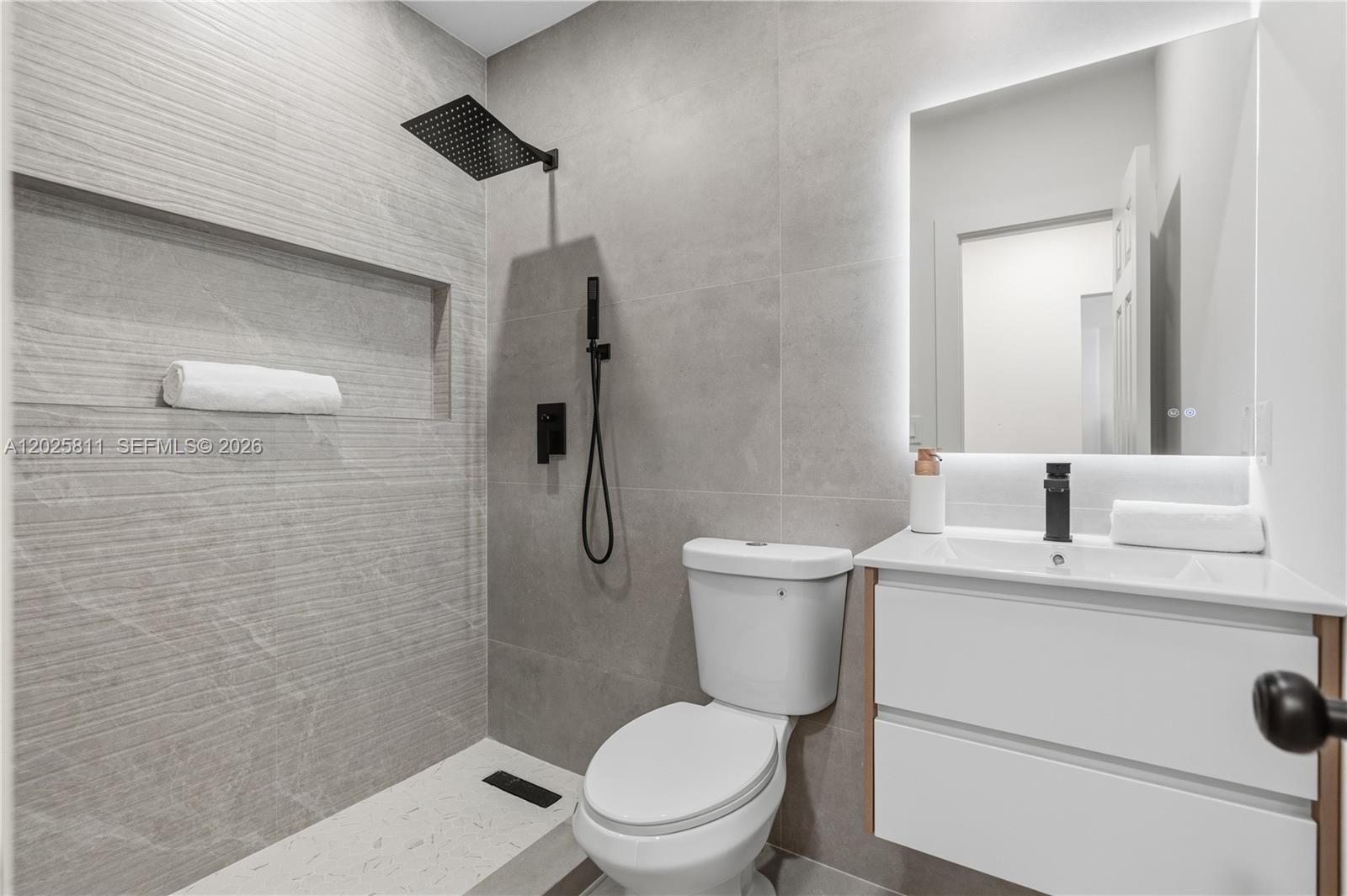 2110 Southwest 15th Street Miami, FL 33145 - Photo 18 of 37 a white toilet sitting next to a bathroom sink
