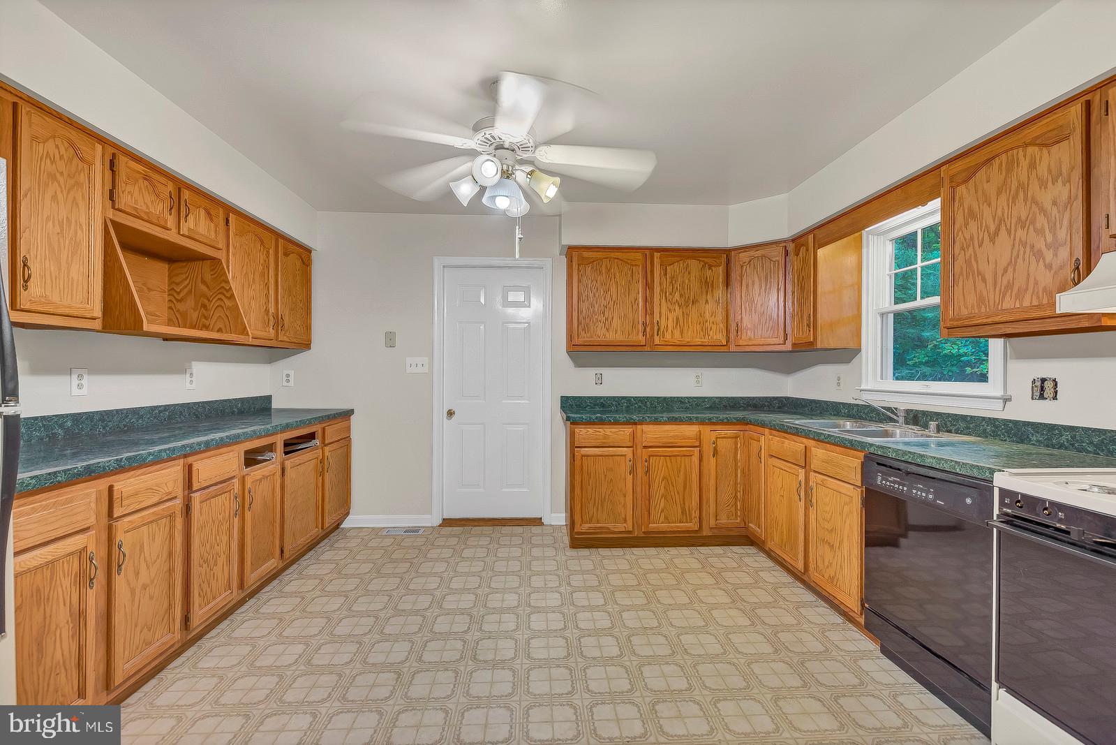 1010 Planters Wharf Road Lusby, MD 20657 - Photo 11 of 26 Ceiling fan ** door is to large 2 car garage