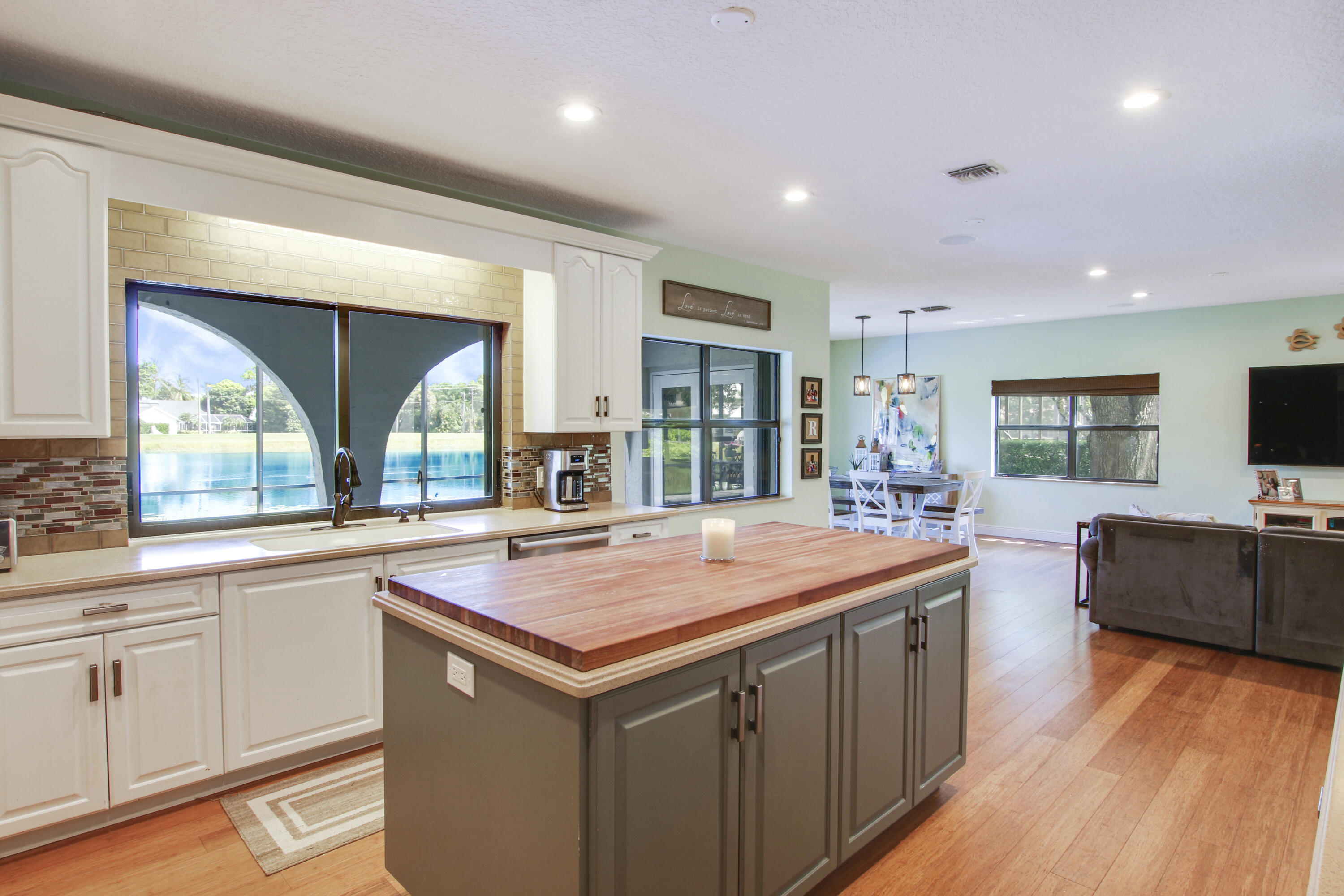 6369 Longleaf Pine Drive Jupiter, FL 33458 - Photo 11 of 53 a kitchen with sink and wooden floor
