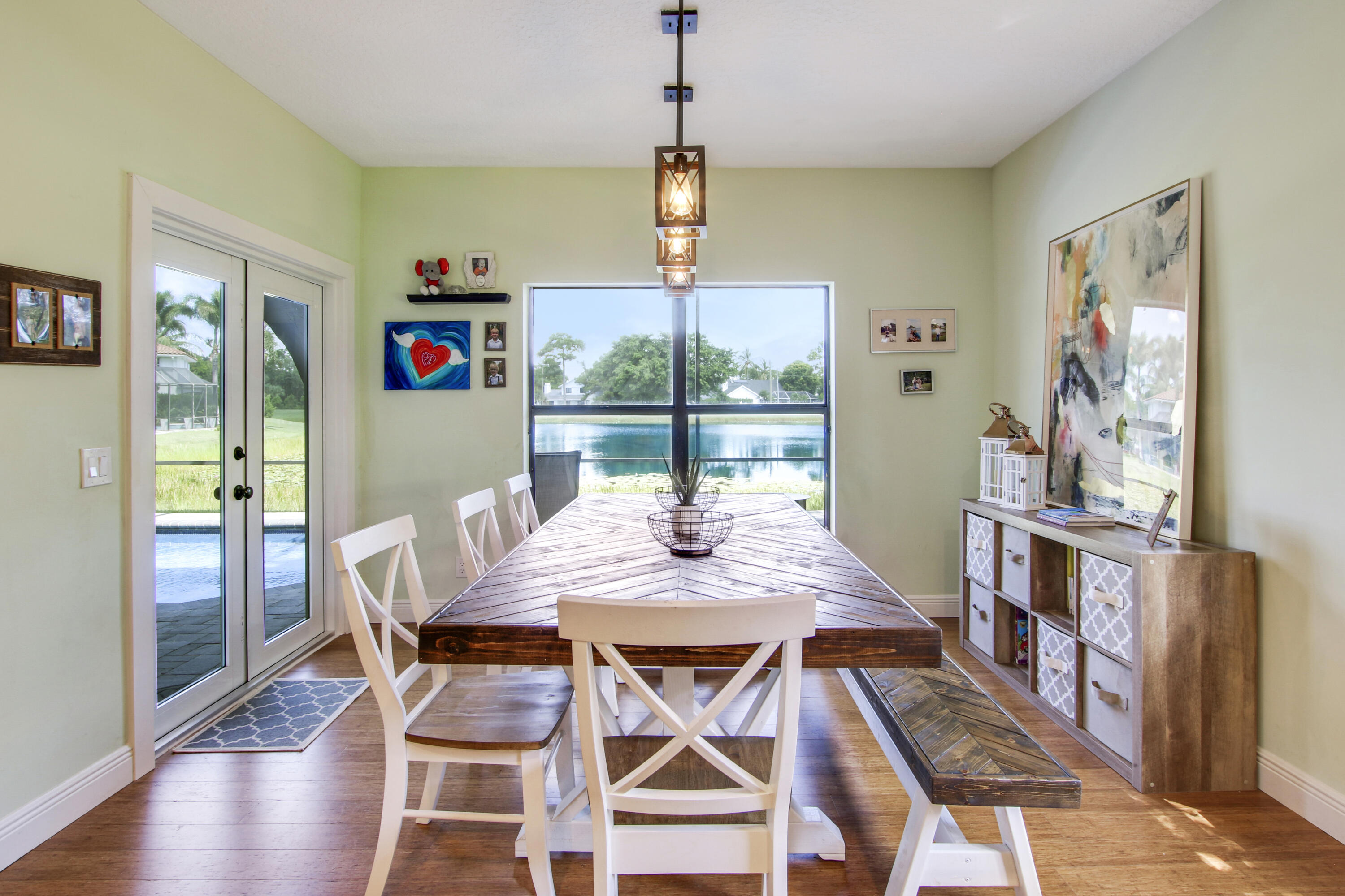 6369 Longleaf Pine Drive Jupiter, FL 33458 - Photo 18 of 53 a view of a dining room with furniture window and wooden floor