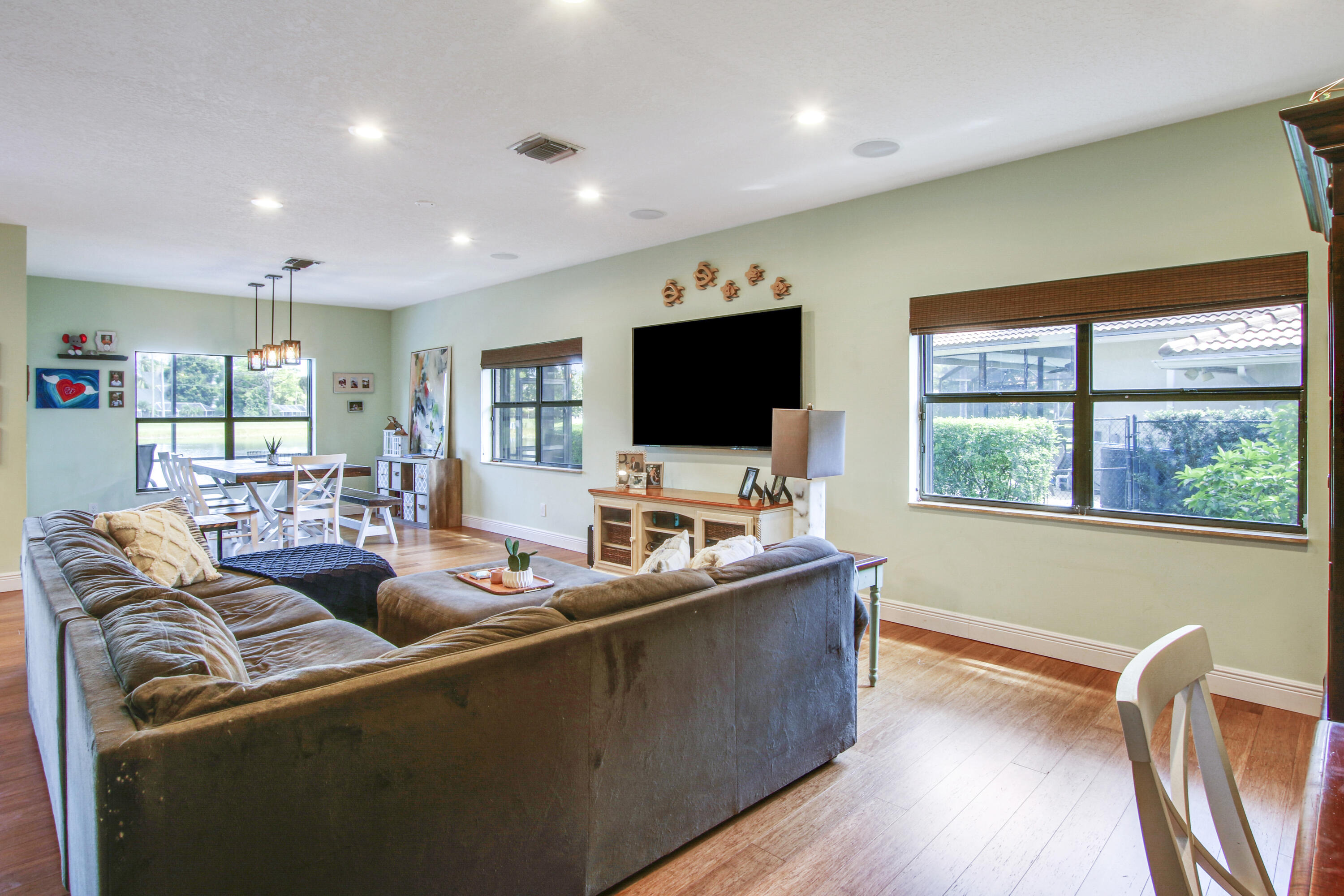 6369 Longleaf Pine Drive Jupiter, FL 33458 - Photo 22 of 53 a living room with furniture and a flat screen tv