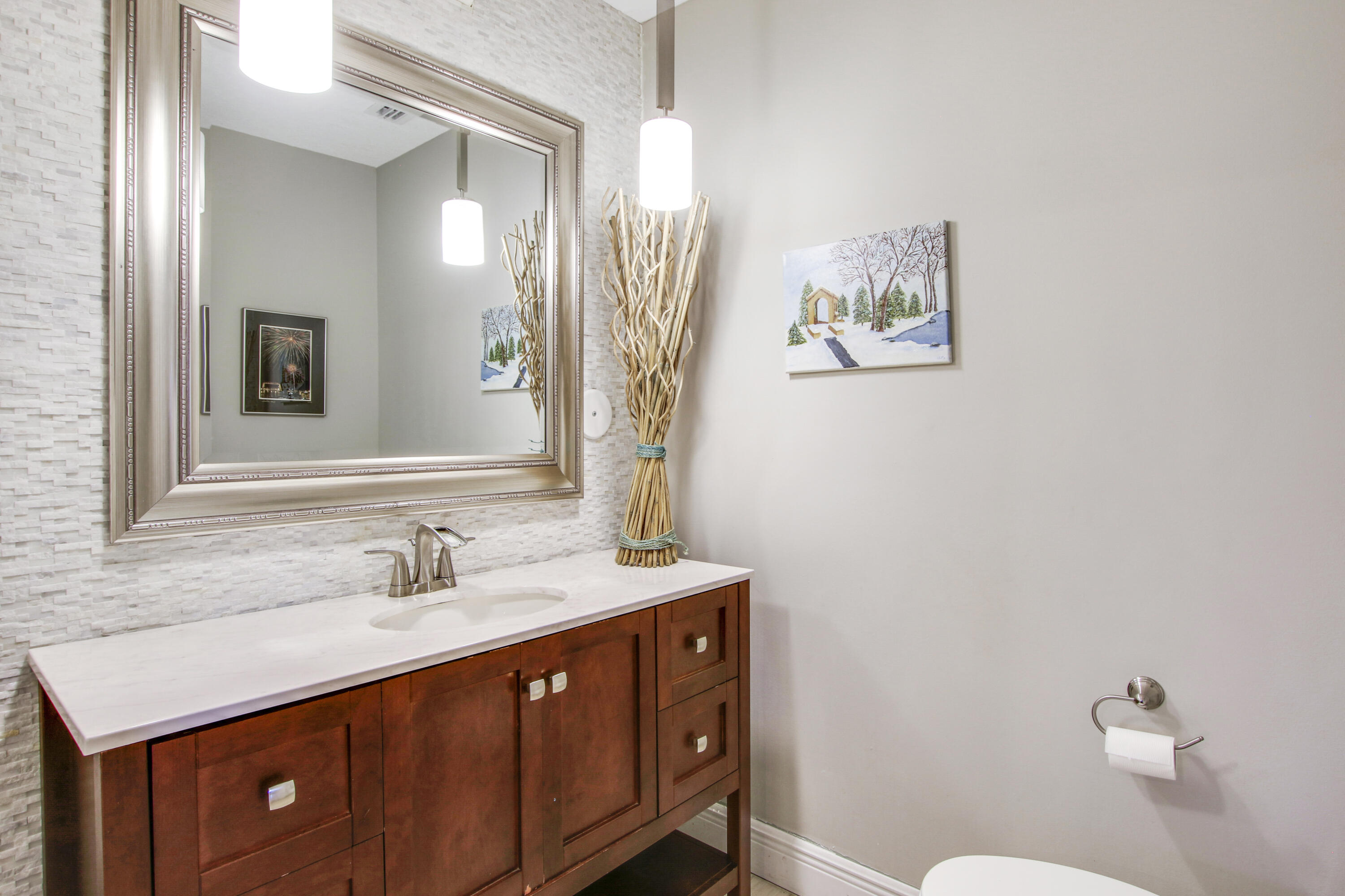 6369 Longleaf Pine Drive Jupiter, FL 33458 - Photo 24 of 53 a bathroom with a sink a toilet and a mirror