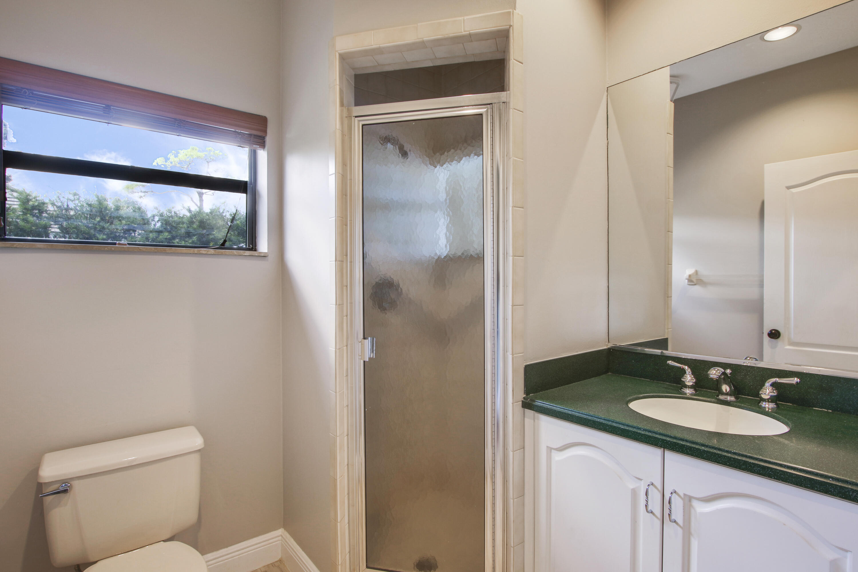 6369 Longleaf Pine Drive Jupiter, FL 33458 - Photo 26 of 53 a bathroom with a sink and a mirror