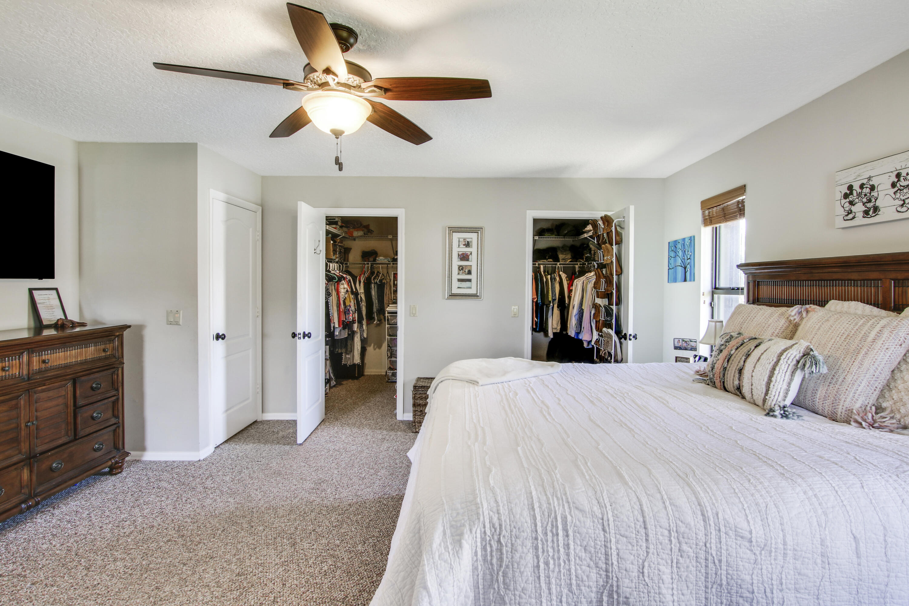 6369 Longleaf Pine Drive Jupiter, FL 33458 - Photo 29 of 53 a bedroom with a large bed and a flat tv screen