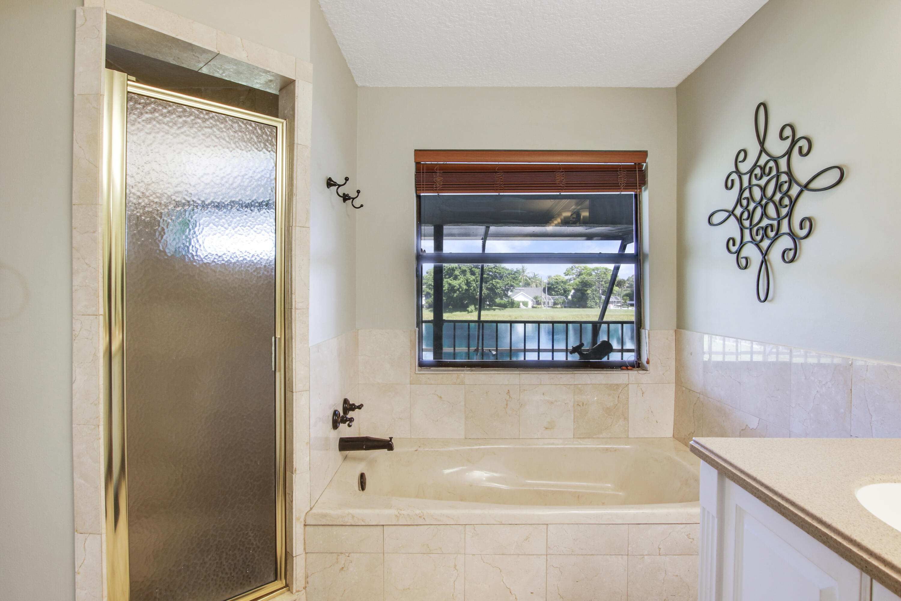 6369 Longleaf Pine Drive Jupiter, FL 33458 - Photo 34 of 53 a bathroom with a bathtub and a shower