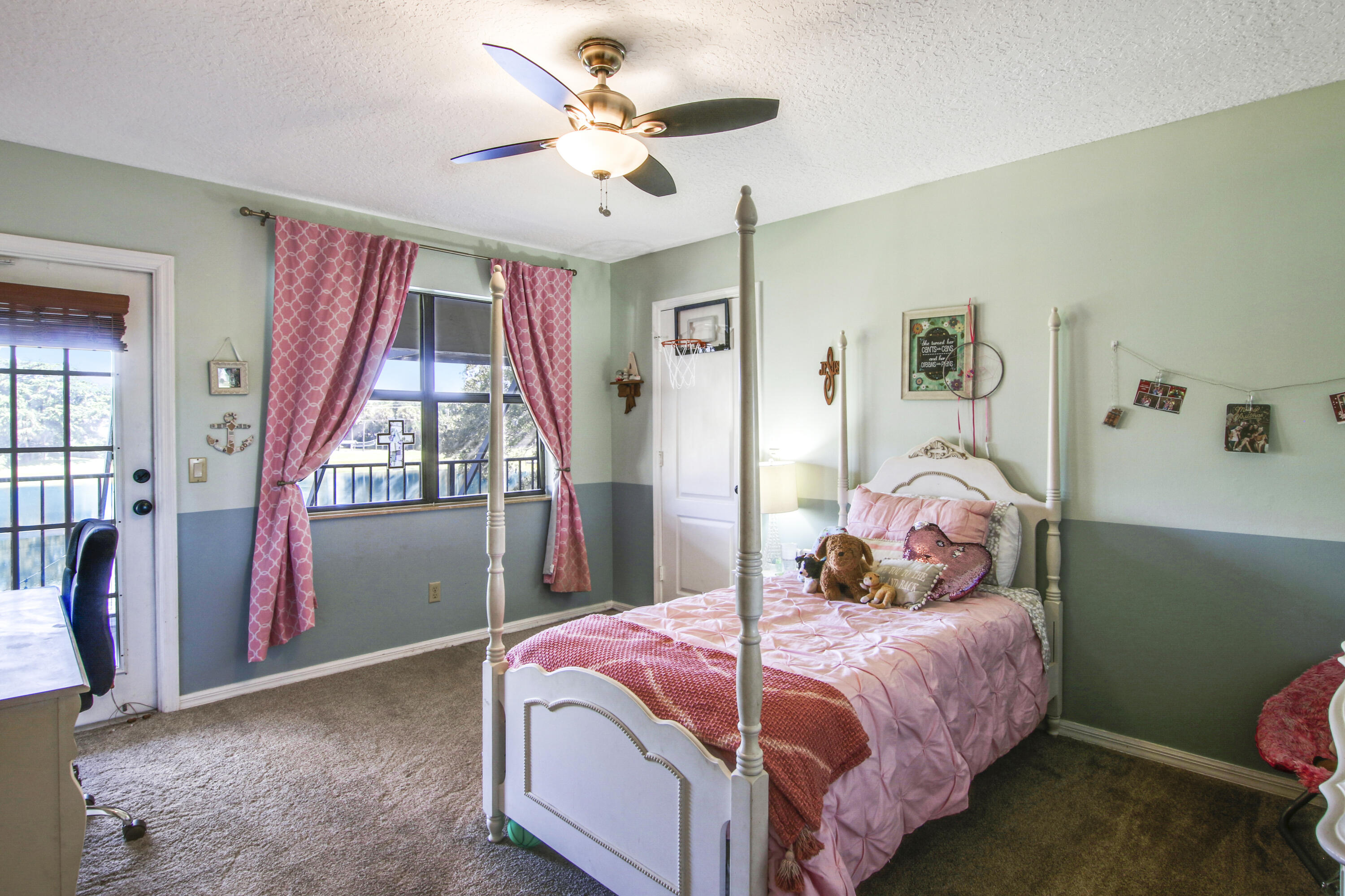 6369 Longleaf Pine Drive Jupiter, FL 33458 - Photo 38 of 53 a bedroom with a bed and a chandelier