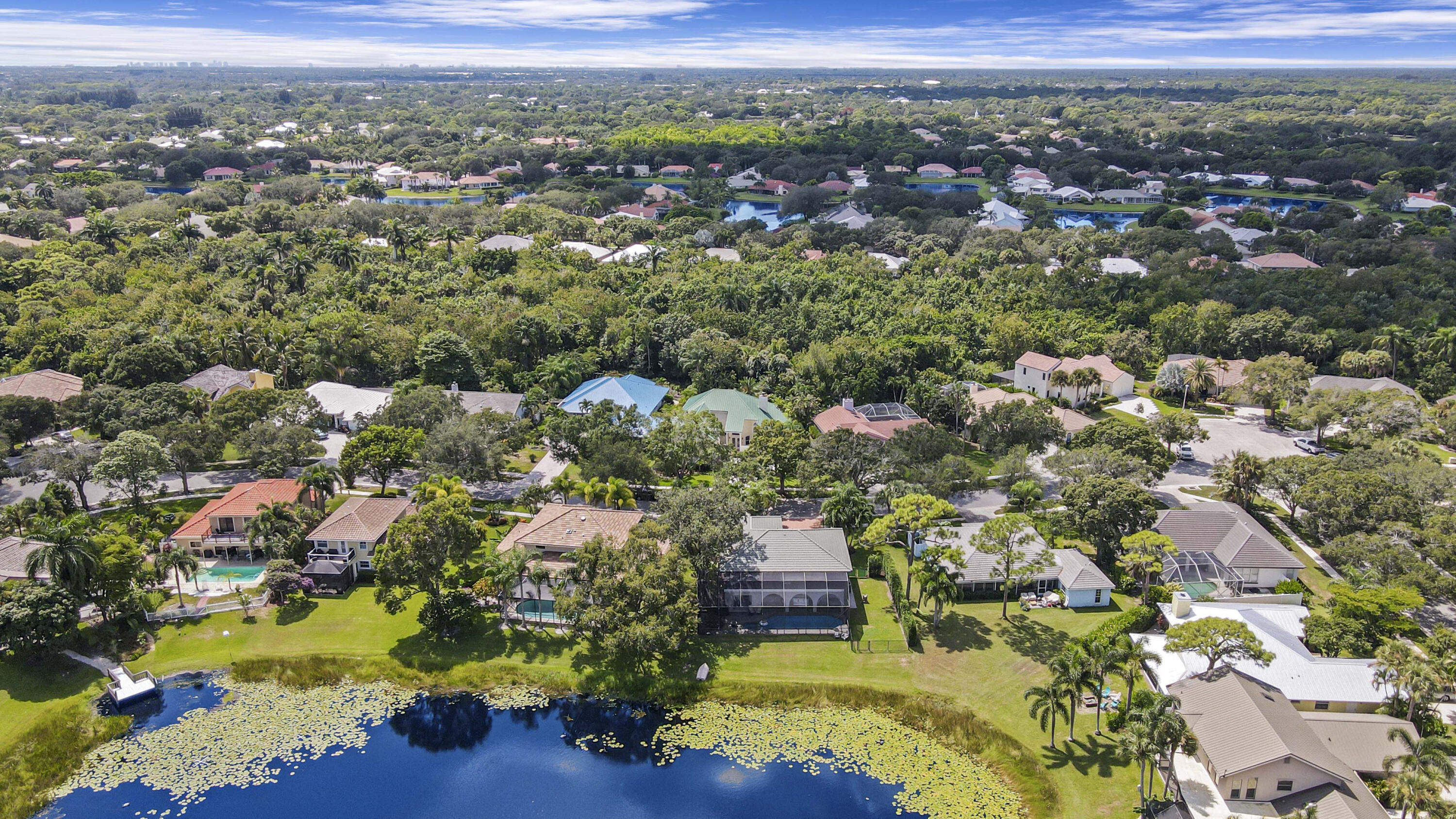 6369 Longleaf Pine Drive Jupiter, FL 33458 - Photo 48 of 53 an aerial view of residential houses with outdoor space and trees
