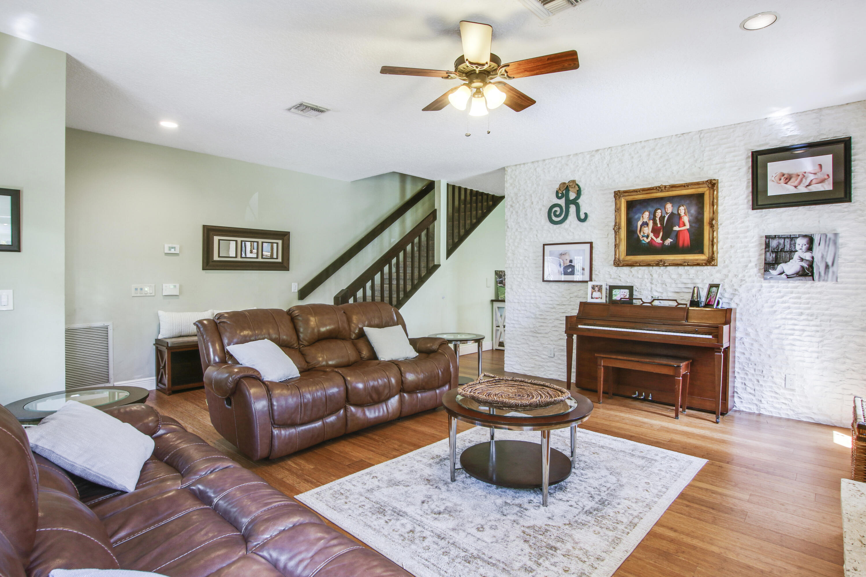 6369 Longleaf Pine Drive Jupiter, FL 33458 - Photo 7 of 53 a living room with furniture a rug and a piano