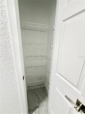 a view of an empty walk in closet