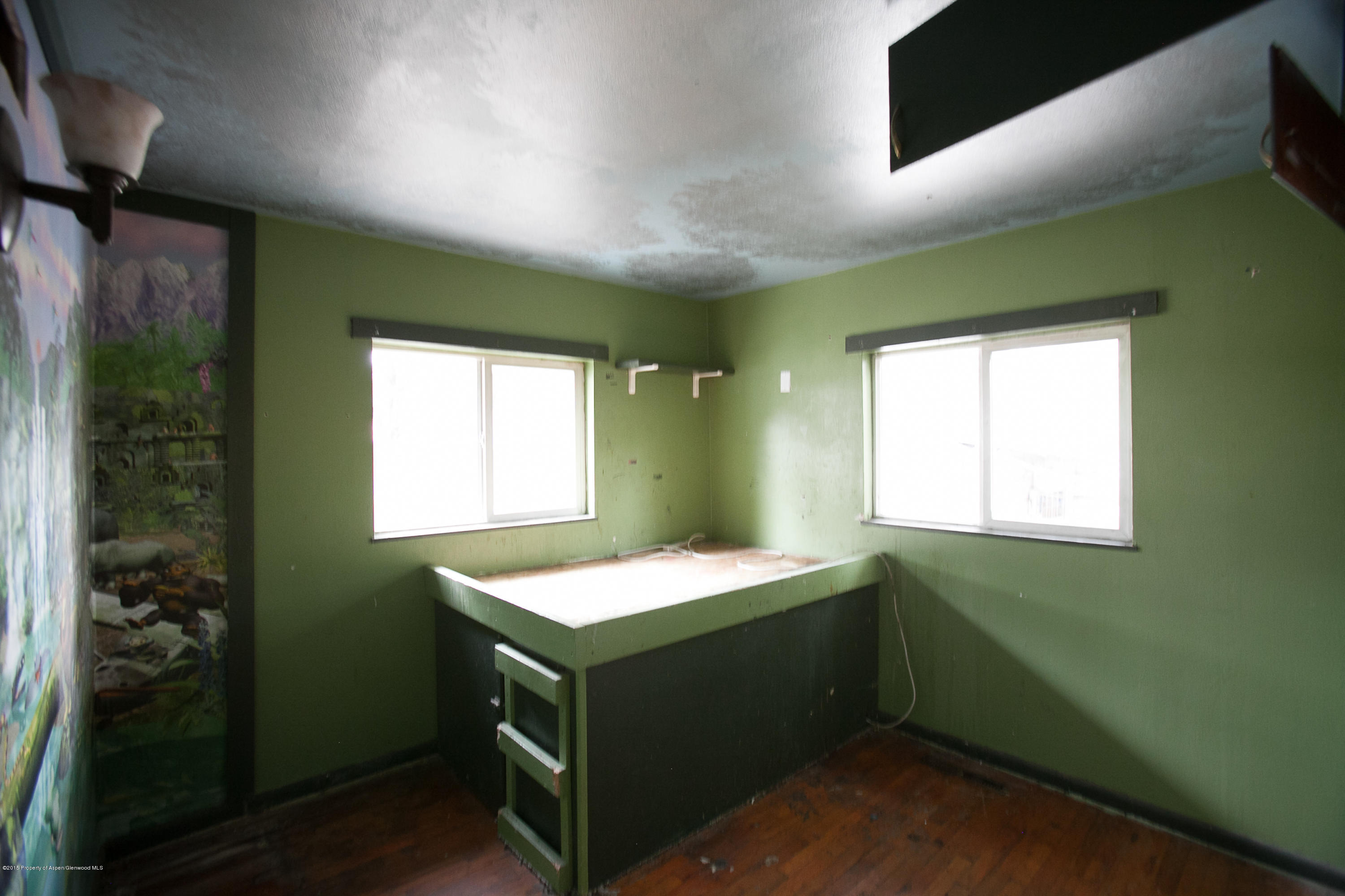 145 June Street Rifle, CO 81650 - Photo 5 of 17 a bathroom with a sink and a mirror