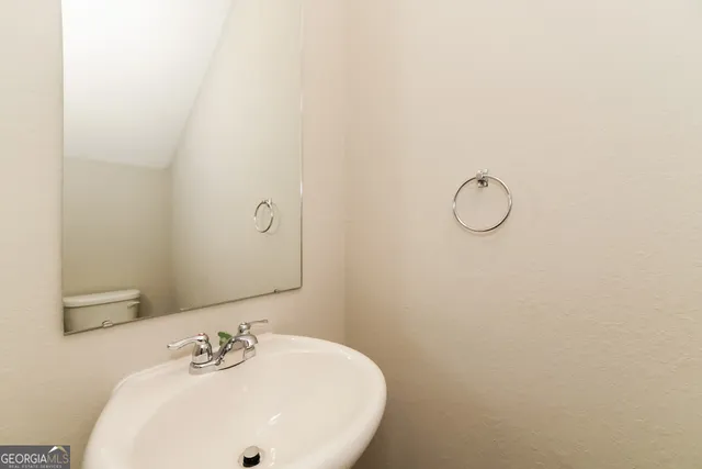 a bathroom with a sink and mirror