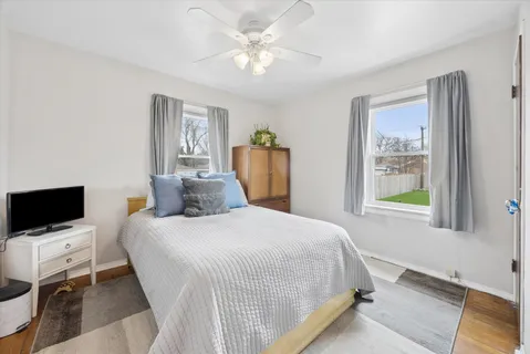 a bedroom with a bed and a tv
