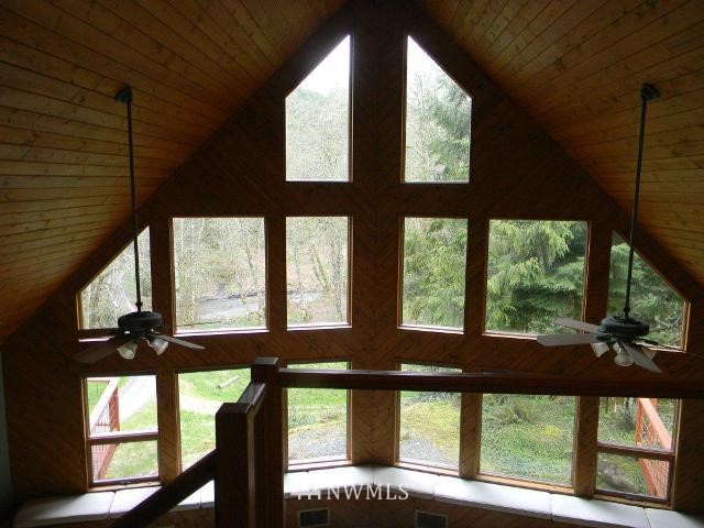 2290 Mosquito Lake Road Deming, WA 98244 - Photo 2 of 15 a view of a porch with a floor to ceiling window