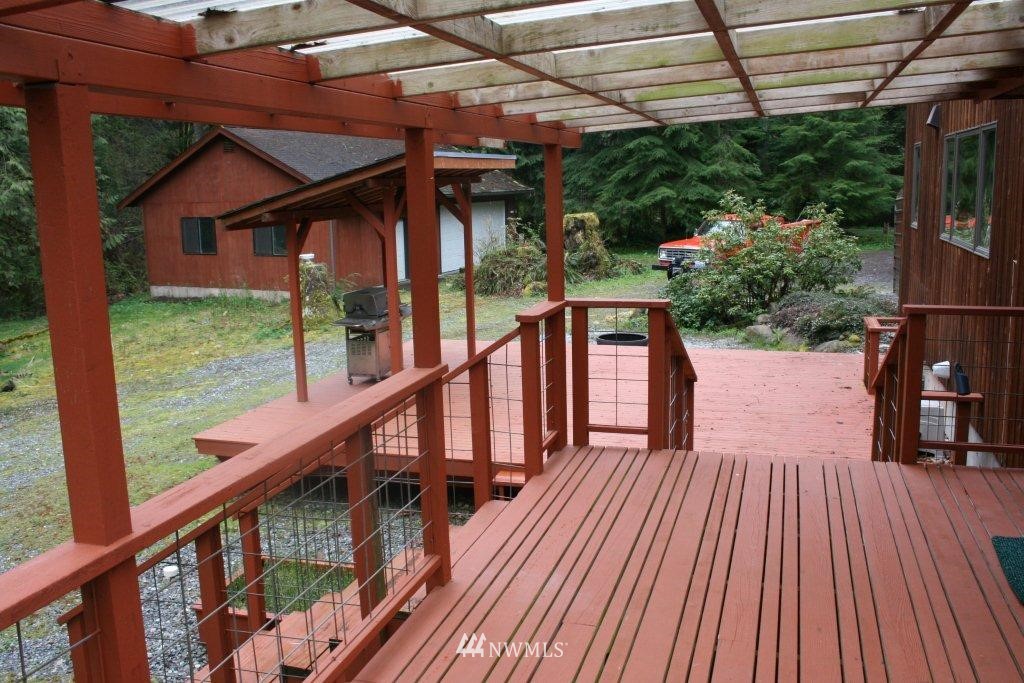 2290 Mosquito Lake Road Deming, WA 98244 - Photo 5 of 15 a view of balcony with wooden floor and outdoor seating