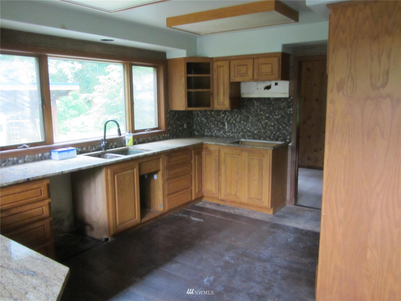 2290 Mosquito Lake Road Deming, WA 98244 - Photo 9 of 15 a kitchen with stainless steel appliances granite countertop a sink stove and cabinets