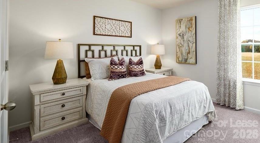 1720 Vanderlyn Street Monroe, NC 28112 - Photo 12 of 33 a bedroom with a bed and a night stand
