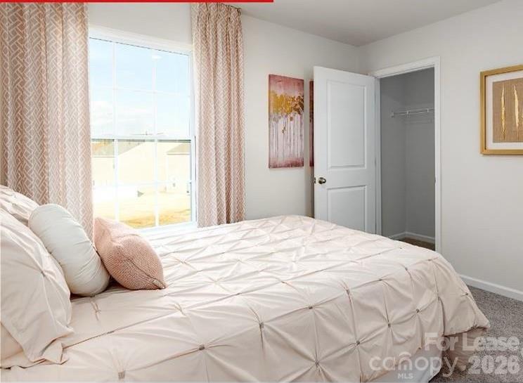 1720 Vanderlyn Street Monroe, NC 28112 - Photo 13 of 33 a bedroom with a bed and a window