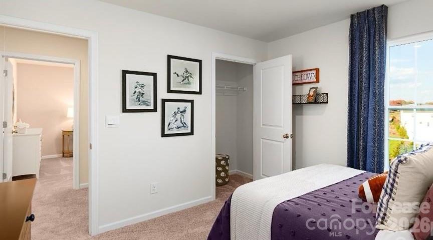 1720 Vanderlyn Street Monroe, NC 28112 - Photo 15 of 33 a bedroom with a bed and a window