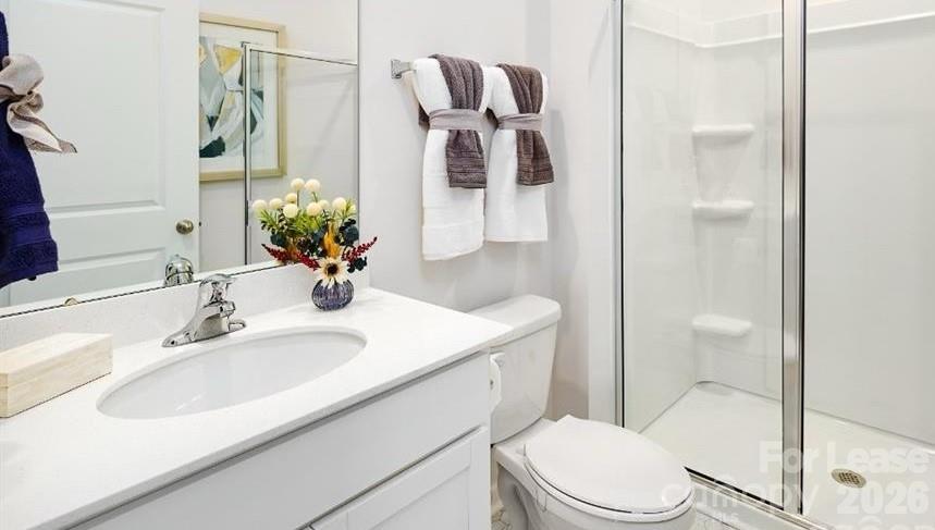 1720 Vanderlyn Street Monroe, NC 28112 - Photo 17 of 33 a bathroom with a sink toilet and shower