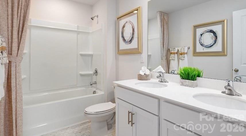 1720 Vanderlyn Street Monroe, NC 28112 - Photo 19 of 33 a bathroom with a granite countertop sink toilet and a bathtub