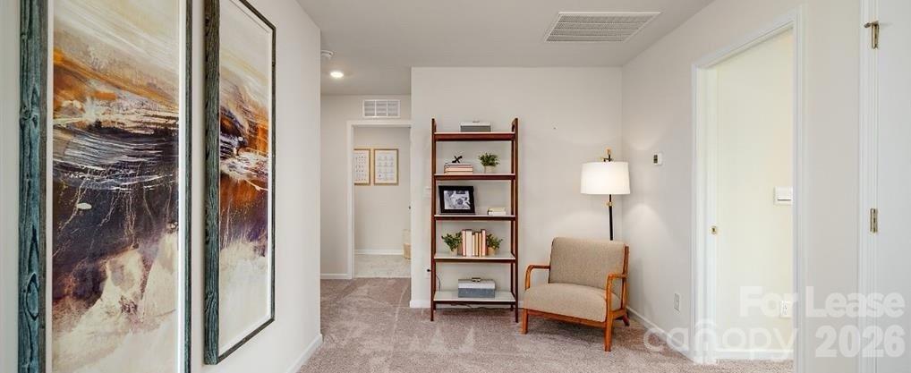 1720 Vanderlyn Street Monroe, NC 28112 - Photo 21 of 33 a living room with furniture and a painting on the wall