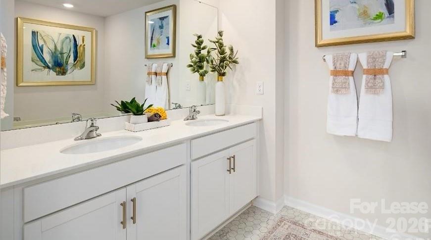 1720 Vanderlyn Street Monroe, NC 28112 - Photo 23 of 33 a bathroom with a sink and a mirror