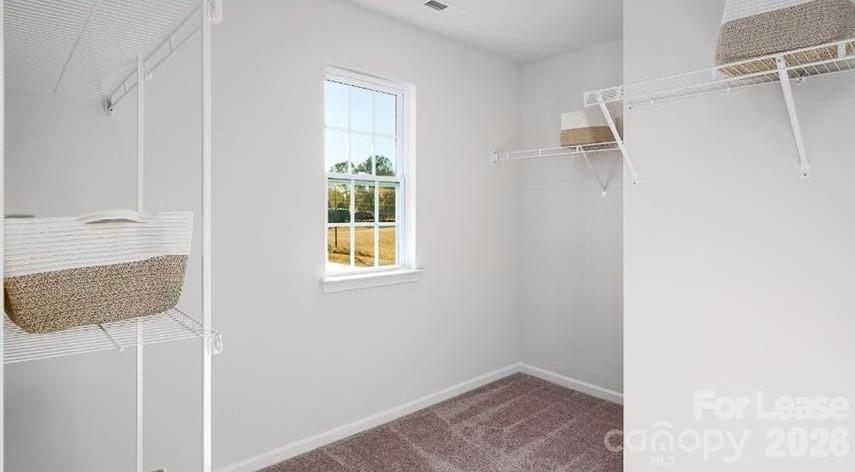 1720 Vanderlyn Street Monroe, NC 28112 - Photo 24 of 33 a view of hallway with windows and cabinet