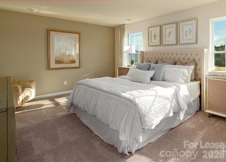 1720 Vanderlyn Street Monroe, NC 28112 - Photo 26 of 33 a bedroom with a bed and a painting on the wall