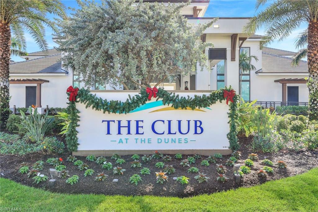 415 Sea Grove Lane, Unit 102 Naples, FL 34110 - Photo 22 of 36 a sign on the side of the road