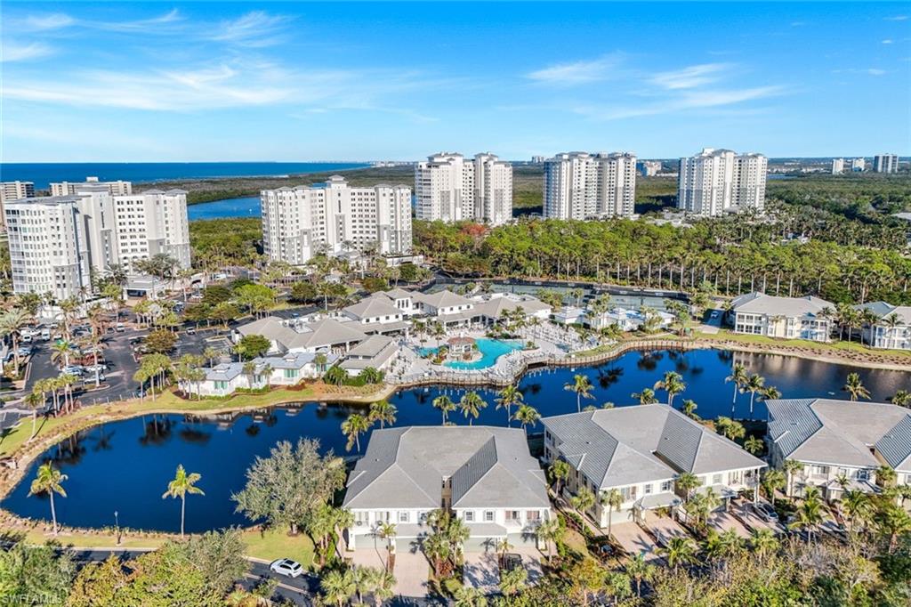 415 Sea Grove Lane, Unit 102 Naples, FL 34110 - Photo 25 of 36 a view of balcony with outdoor seating and city view