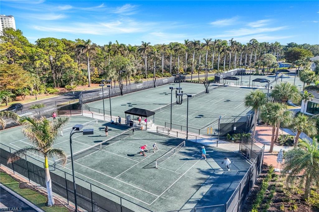 415 Sea Grove Lane, Unit 102 Naples, FL 34110 - Photo 33 of 36 a view of a terrace with chairs