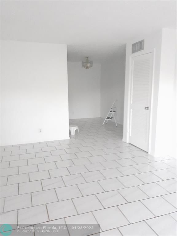 Undisclosed Address Coral Springs, FL 33065 - Photo 3 of 13 a view of an empty room and has white walls