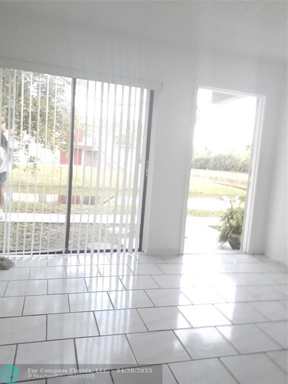 Undisclosed Address Coral Springs, FL 33065 - Photo 4 of 13 a view of an empty room and a window