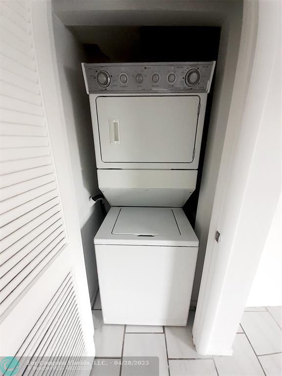 Undisclosed Address Coral Springs, FL 33065 - Photo 8 of 13 a utility room with dryer and washer