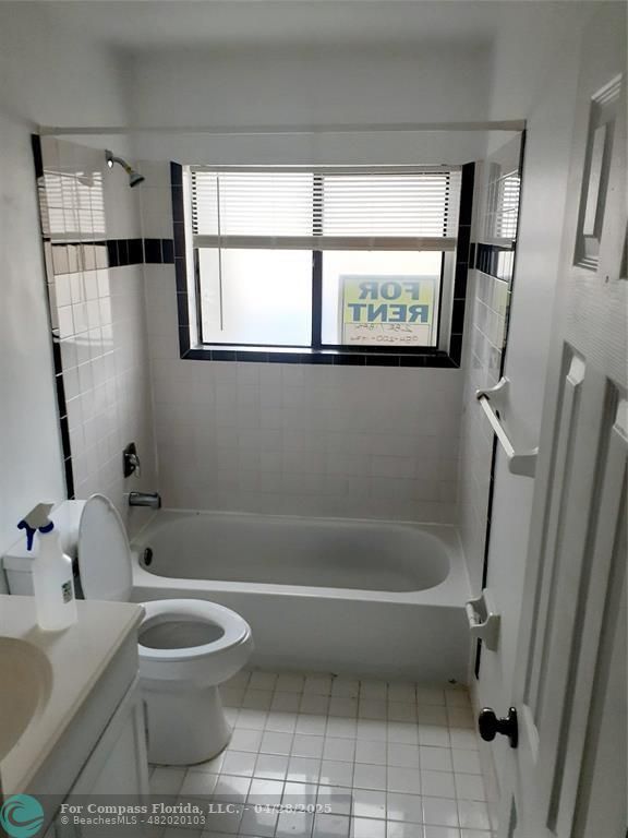 Undisclosed Address Coral Springs, FL 33065 - Photo 10 of 13 a bathroom with a toilet a sink and a bathtub