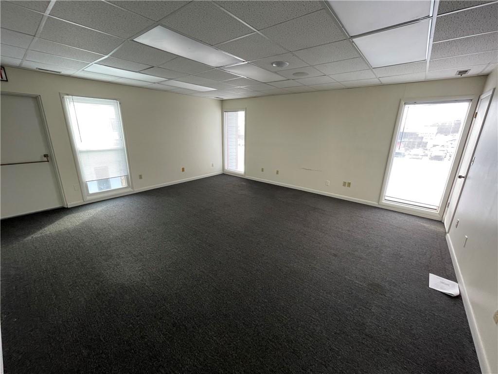 259 Pittsburgh Road, Unit 8 Butler, PA 16002 - Photo 6 of 9 a view of a livingroom with an empty space and a window