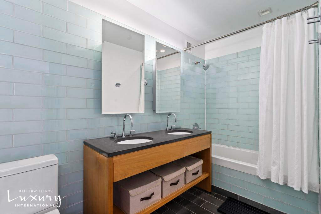 310 West 52nd Street, Unit 5J Manhattan, NY 10019 - Photo 10 of 16 a bathroom with a sink and a mirror