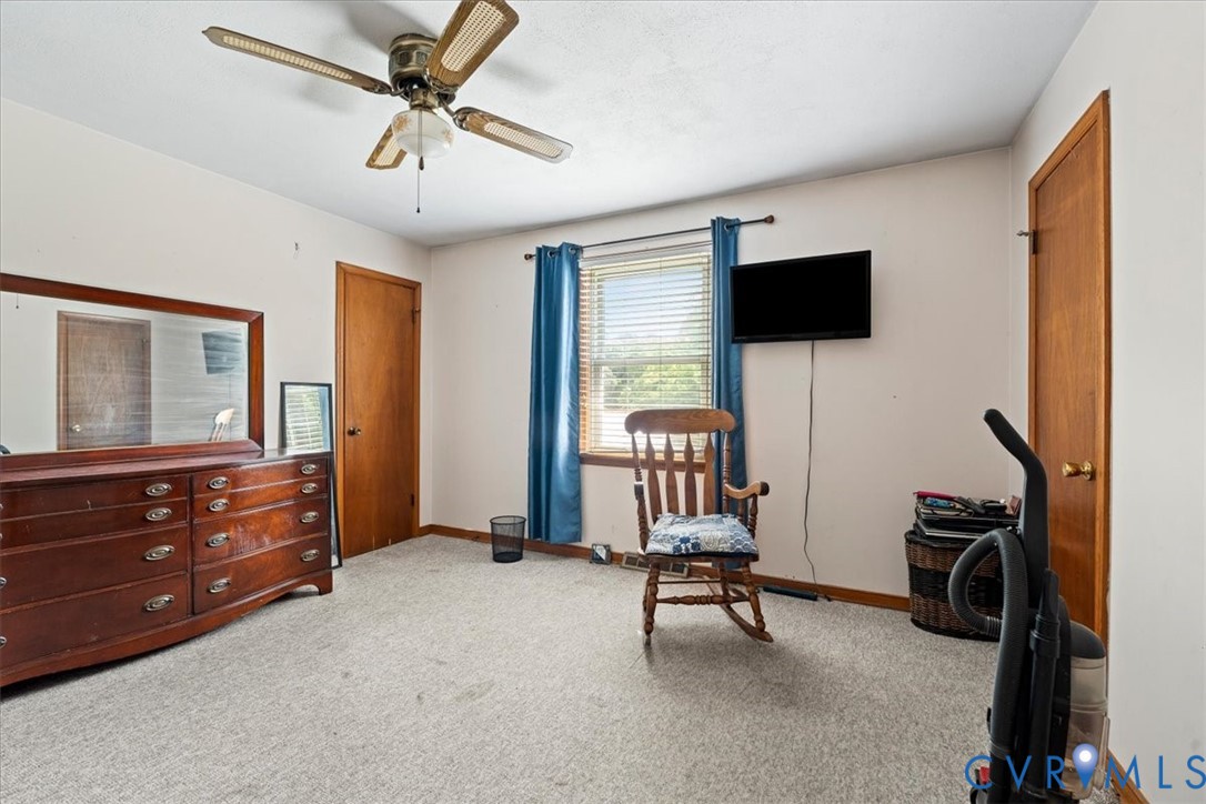 296 Rices Depot Road Rice, VA 23966 - Photo 17 of 32 Carpeted room featuring a ceiling fan with light f